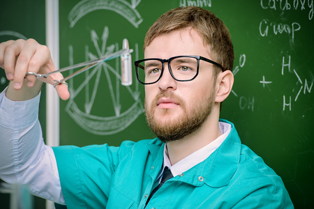 Smart man scientist making chemical experiments in the laboratory. Educational concept. Discovery.の写真素材