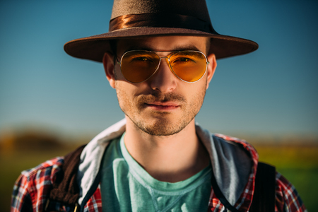 A portrait of a traveller in the field. Nature, freedom. Fashion for active men.の写真素材
