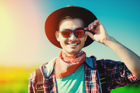 A portrait of a traveller in the field. Nature, freedom. Fashion for active men.の写真素材