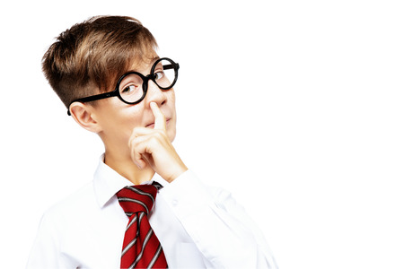 Portrait of emotional schoolboy in glasses. Childhood, education. Kid, studying.の写真素材