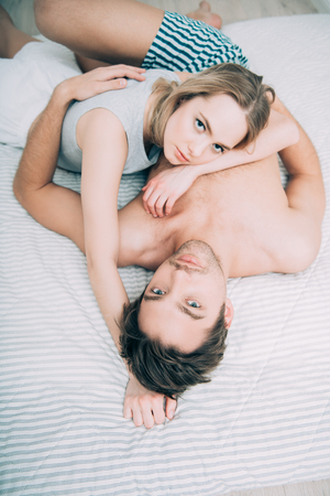 A couple of lovers are lying in bed. Health, beauty, underwear, pyjamas.の写真素材