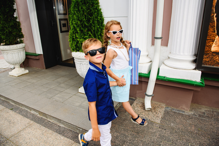 Little children are doing shopping. Fashion concept. Summer.の写真素材