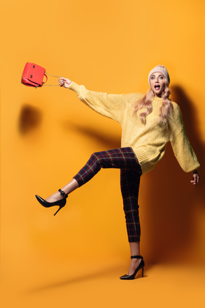 Fashionable bright lady posing in studio. Fashion for women.の写真素材
