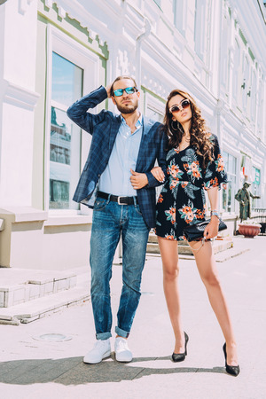 Portrait of a beautiful young people walking in the city. Summer fashion.の写真素材
