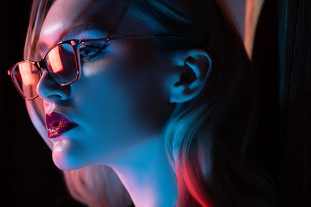 A close up portrait of an elegant lady wearing glasses. Beauty, make-up, style.の写真素材