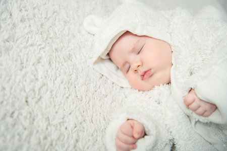 A portrait of a cute sleeping baby. Happiness, parenthood. Goods for newborns.