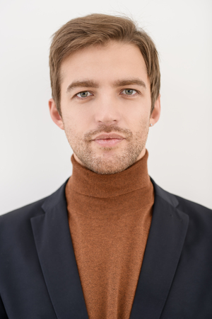 A portrait of a handsome man over the white background. Beauty, fashion for men.の写真素材