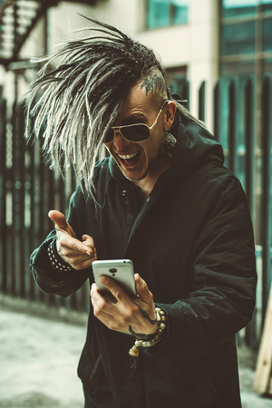 Portrait of a punk man on the street. Fashion, subculture.の写真素材