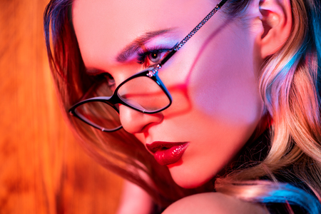 A close up portrait of an elegant lady wearing glasses. Beauty, make-up, style.の写真素材