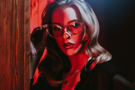A close up portrait of an elegant lady wearing glasses. Beauty, make-up, style.の写真素材