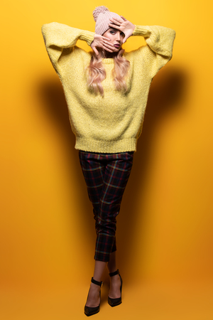 Fashionable bright lady posing in studio. Fashion for women.の写真素材