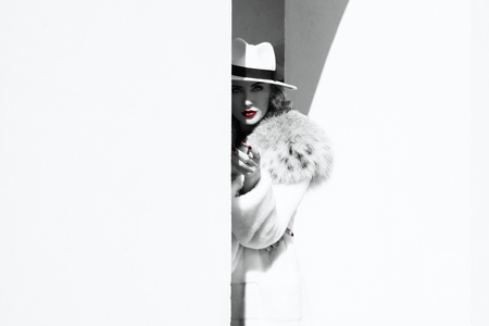 A portrait of a beautiful blonde lady walking in the street. Beauty, urban fashion, style.の写真素材