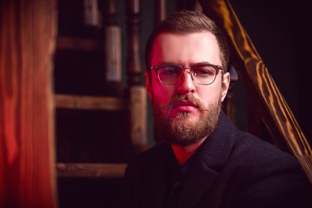 A portrait of a stylish man wearing sunglasses. Beauty and style for men.の写真素材