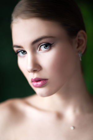 A close up portrait of a dreamy lady posing indoor. Cosmetics, beauty.の写真素材