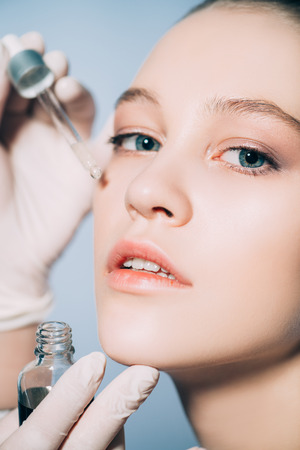 Close up portrait of a beautiful young woman with a skin nutrition. Beauty, skin care,  cosmetology.の写真素材