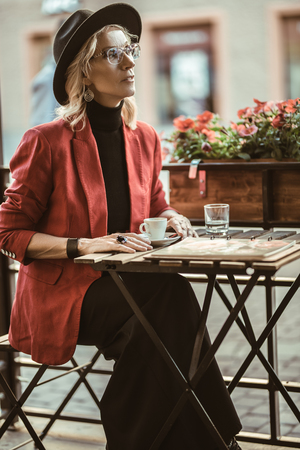 A portrait of an elegant elderly woman at the cafe. Beauty, fashion.の写真素材