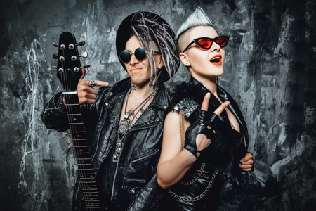 A portrait of two stylish punk men in the street. Modern men fashion, rock musicians.の写真素材