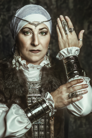 Portrait of an elderly native woman. A national costume. Mature lady.の写真素材
