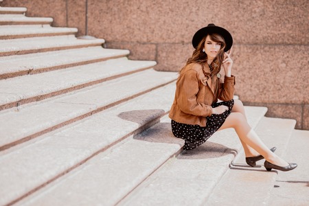 A full length portrait of a young pretty fashionable woman in the city. Beauty, fashion.の写真素材
