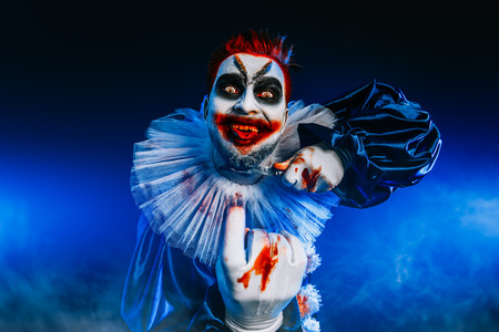 A portrait of an angry crazy clown from a horror film. Halloween, carnival.の写真素材