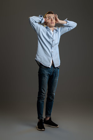 A full length portrait of a young goodlooking guy. Men casual fashion.の写真素材