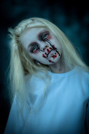 A portrait of a scary pale girl from horror film. Zombie, halloween.