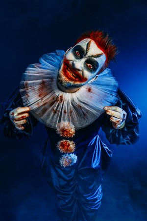 A portrait of an angry crazy clown from a horror film. Halloween, carnival.の写真素材