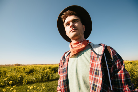 A portrait of a traveller in the field. Nature, freedom. Fashion for active men.の写真素材