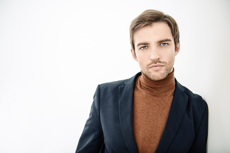 A portrait of a handsome man over the white background. Beauty, fashion for men.の写真素材