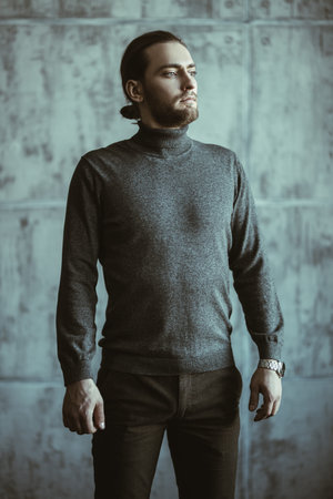 A portrait of a thoughtful handsome man wearing casual clothes in the studio. Men's beauty, casual...