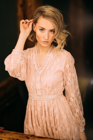 A portrait of a beautiful girl posing while doing make up. Beauty, make up.の写真素材