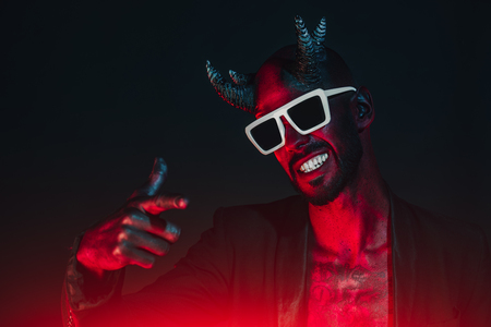 A portrait of a bad demon in sunglasses. Horror movie, nightmare. Halloween.の写真素材