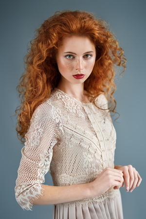 Beautiful young woman with long red hair. Hair care, hair coloring.の写真素材