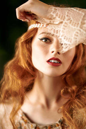 Portrait of a beautiful red-haired girl. Hair coloring. Hippie style. Bohemian style.の写真素材