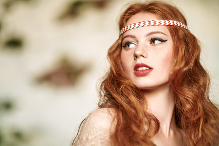 Portrait of a beautiful red-haired girl. Hair coloring. Hippie style. Bohemian style.の写真素材