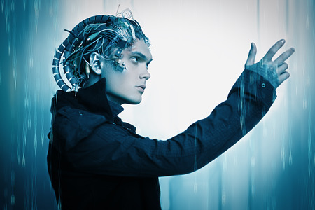 Cyborg looks at his hand over digital background. Biological human robot with wires implanted in the head. Technologies of the future.の写真素材