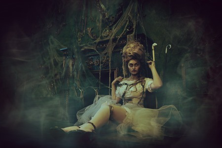 Halloween. Portrait of the dead empress in the old abandoned castle. Ghost in the castle. Vintage style.の写真素材