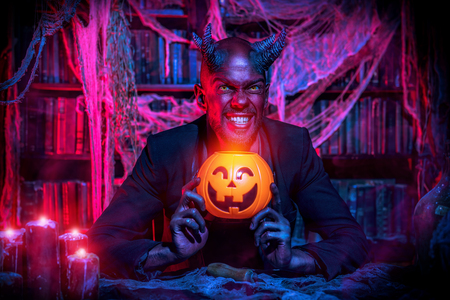 A portrait of a bad demon in his den. Horror movie, nightmare. Halloween.の写真素材