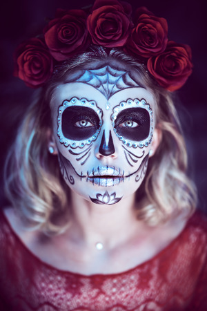Sugar skull girl. Day of The Dead. Dia de los muertos. Charming and dangerous Calavera Catrina in an old abandoned house.  Halloween.の写真素材