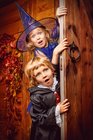 Happy children in witch and vampire costumes celebrate halloween. Trick or treat. Halloween.の写真素材