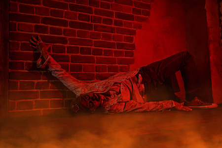 Scary bloodthirsty zombie man in a ruined building. Horror. Halloween.の写真素材