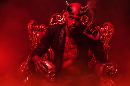 A portrait of a bad demon in his throne. Horror movie, nightmare. Halloween.の写真素材