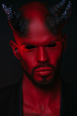 A close-up portrait of a bad demon. Horror movie, nightmare. Halloween.の写真素材