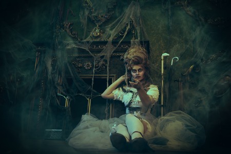 Halloween. Portrait of the dead empress in the old abandoned castle. Ghost in the castle. Vintage style.の写真素材
