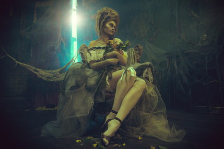 Halloween. Portrait of the dead empress in the old abandoned castle. Ghost in the castle. Vintage style.の写真素材