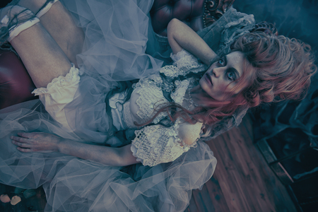 Halloween. Portrait of the dead empress in the old abandoned castle. Ghost in the castle. Vintage style.の写真素材