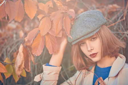 Autumn portrait of a beautiful modern girl. Fashion model, autumn style.の写真素材