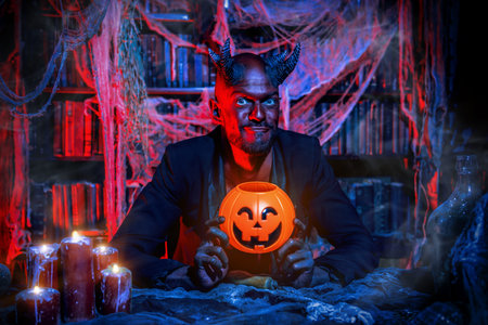 A portrait of a bad demon in his den. Horror movie, nightmare. Halloween.