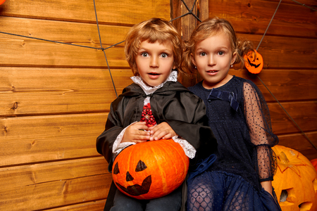 Happy children in witch and vampire costumes celebrate halloween. Trick or treat. Halloween.の写真素材