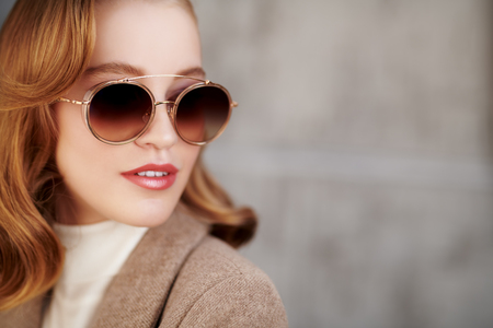 Modern business woman in formal clothes and sunglasses. Beauty, fashion. Optics and eyewear style. Copy space.の写真素材